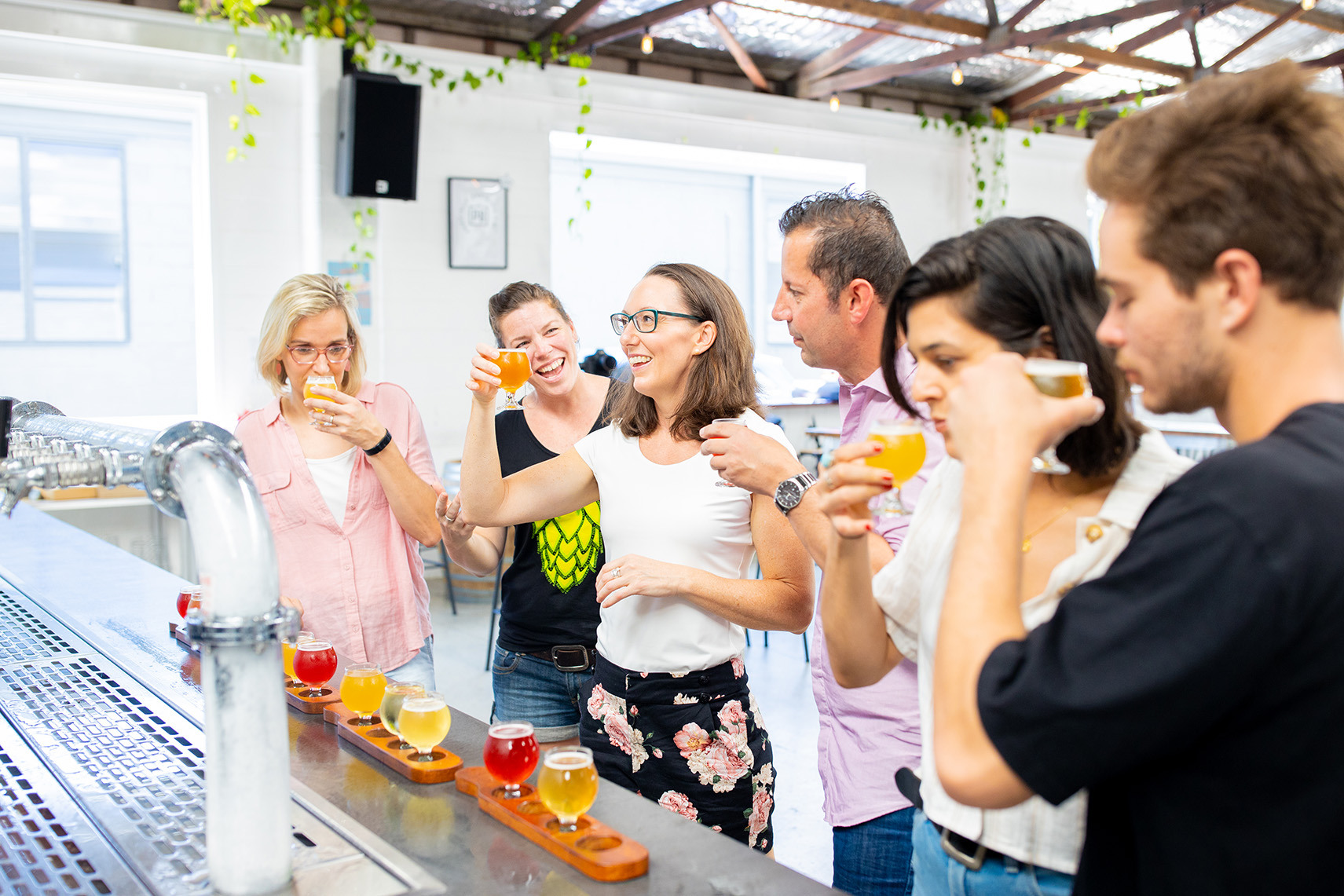 A group of friends tasting beers at a Gold Coast brewery.