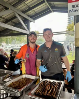 Matt and Lachie Serving up the Sausage Sizzle