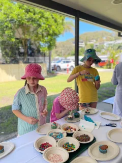 3 girls decorating cupcakes